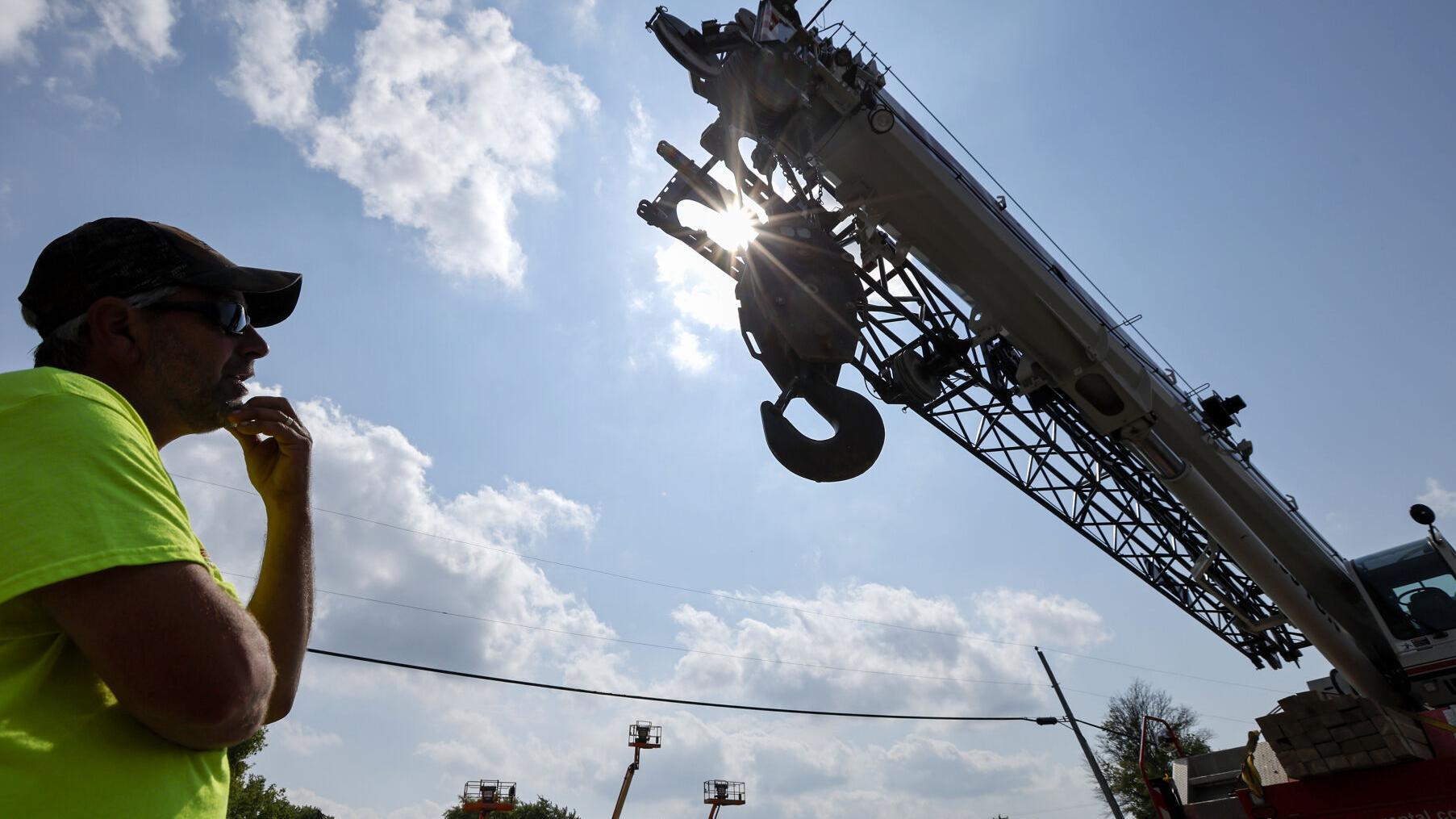Crane operator does the heavy lifting in new construction